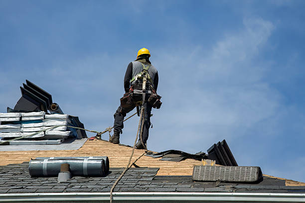 Professional Roofing technician working in Saint Georges, DE